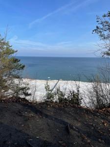 a view of a beach with the ocean in the background at Haus Sonnenschein in Koserow