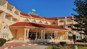 a large building with a sign on top of it at Mehari Tabarka in Tabarka