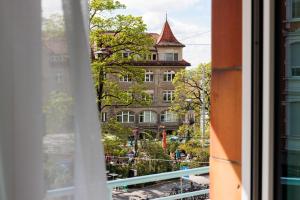 a view of a building from a window at Fred Hotel Central in Zurich