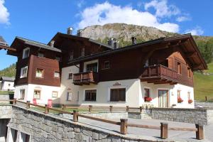 a house in front of a mountain at Chalet Betty in Livigno