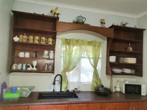 a kitchen with a sink and a window at My Serenity Guesthouse in Mokopane