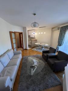a living room with a couch and a table at Bar Luxury Apartment in Bar