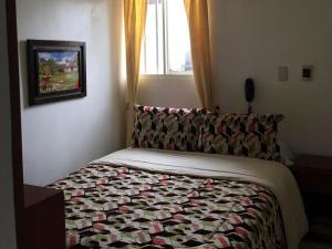 Postel nebo postele na pokoji v ubytování La Gran Fortaleza B&B
