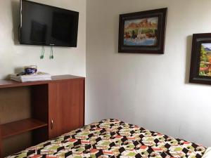 Postel nebo postele na pokoji v ubytování La Gran Fortaleza B&B