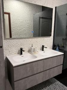 a bathroom with a sink and a mirror at Berckenhof in Heusden - Zolder +20 photos