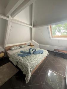 a room with a bed with two towels on it at Berckenhof in Heusden - Zolder