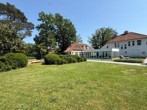 a large house with a yard in front of it at Berckenhof in Heusden - Zolder