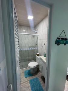a bathroom with a toilet and a shower and a sink at Suíte Maresia - Pousada Castelo do Luar in Penha +25 photos