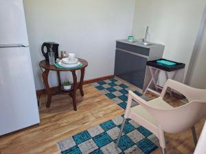 a small kitchen with a table and a sink at Steijn Apartment 1 in Standerton