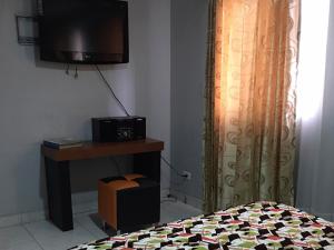 TV a/nebo společenská místnost v ubytování La Gran Fortaleza B&B