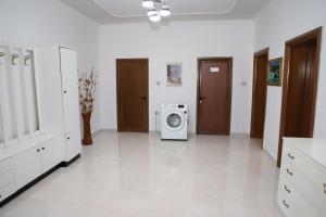 a laundry room with a washing machine in it at A&B Berat in Berat