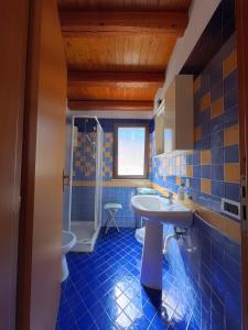 a bathroom with a sink and a toilet at millennium holiday in Castellammare del Golfo +31 photos