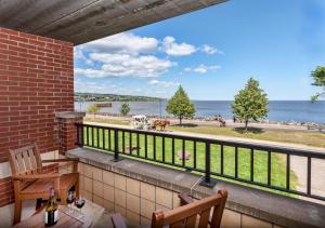 a balcony with a view of the ocean at The Inn on Lake Superior in Duluth