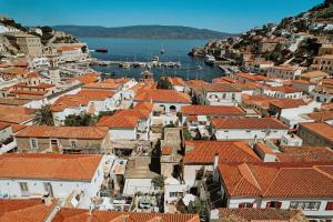 an aerial view of a town with red roofs at Mastoris Mansion in Hydra