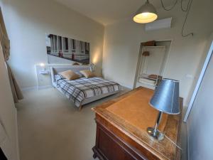 a bedroom with a bed and a table with a lamp at Fp Monza Railways in Monza