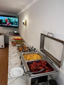 a buffet with many different types of food on a counter at Hotel Zallina in Theth +39 photos