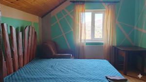 a bedroom with a bed and a window at Milana Guesthouse in Slavske +54 photos
