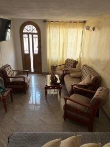 a living room with couches and a table at El Palmar in Palmira