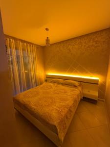 a bedroom with a bed with a light on it at smir park Mdiq in M'diq +16 photos