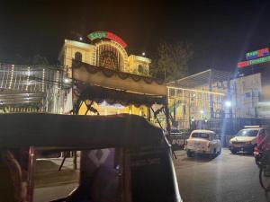 a car parked in front of a building at night at Raya's Executive Homes in Kumbakonam