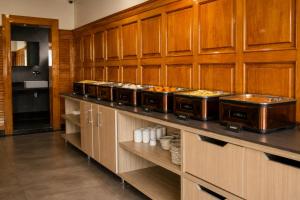 a kitchen with a bunch of food on display at Alasha Retreat in Srinagar
