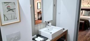 a bathroom with a white sink and a mirror at Mili's B&B Guest House in Gabrovo +27 photos