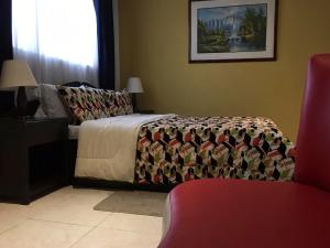 Postel nebo postele na pokoji v ubytování La Gran Fortaleza B&B