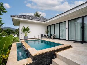 an image of a swimming pool in a house at Nirvana Phangan Villas - Luxury & Serenity in Wok Tum