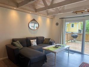 a living room with a couch and a table at Hus Rusken in Stockaryd