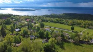 an aerial view of a village with a lake at Hus Rusken in Stockaryd