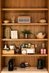 a shelf with a microwave and other items on it at Mountain View Room mit sonnigem Wintergarten in Dietmannsdorf bei Trieben +18 photos