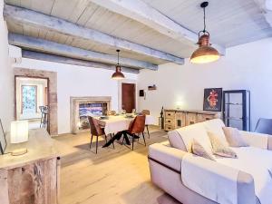 a living room with a white couch and a table at Apartment Novecento by Interhome in Monterotondo