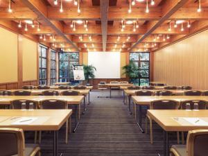 an empty dining room with tables and chairs at Mercure Hotel am Messeplatz Offenburg in Offenburg +113 photos