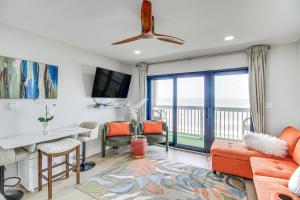 a living room with a view of the ocean at Unwind by the Beach | Pool and Oceanfront View in Corpus Christi