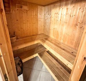 a wooden sauna with a wooden floor in a room at Seebrise Baabe in Baabe +13 photos