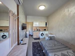 a laundry room with a washer and dryer at relax in Plovdiv +37 photos