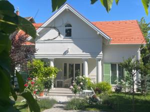 a white house with an orange roof at Villa Rosa Centre in Balatonfüred