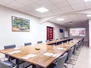 a large conference room with a large wooden table and chairs at Le Lodge des Almadies in Dakar +87 photos