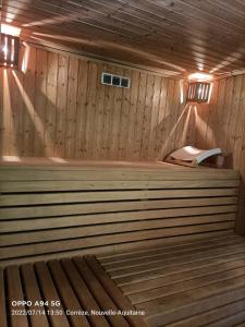 a inside of a sauna with a bench in it at Ted et Breakfast in Corrèze