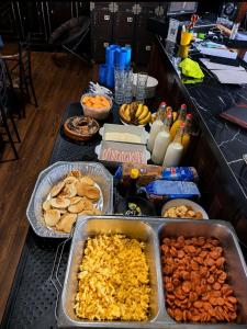 a buffet with many different types of food on a table at Hostel Museo Relic in Panama City +16 photos