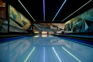 a swimming pool with blue lanes in a building at Złoty Łan in Nowa Sól