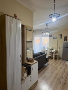 a living room with a couch and a dining room at B&B Tirane in Tirana