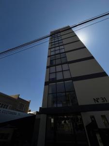 a tall building with a lot of windows at Aura Exclusive - Achumani in La Paz