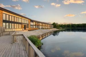 a building next to a body of water at Best Western Indian Oak in Chesterton