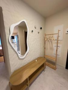 a dressing room with a mirror on the wall at City View Apartment in Râmnicu Vâlcea