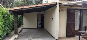 a garage with a door and a washing machine at Maison à la mer in Vendres