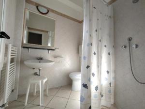 a bathroom with a sink and a toilet and a shower at B&B Residence Sorriso in Cattolica +12 photos