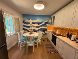 a kitchen with a table and chairs in a room at Villa Zen Oasis in Golem