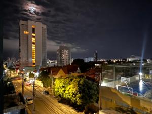 a view of a city at night with buildings at Smart & Comfort 4 - Ap completo in Campina Grande