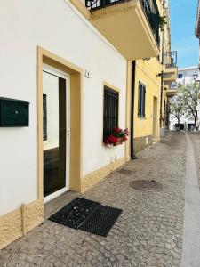 an alley with a door on a building at Victoria in Olbia